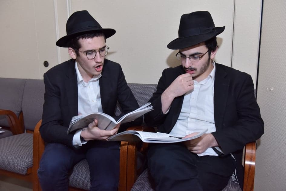 Two bochurim learning Likkutei Sichos together